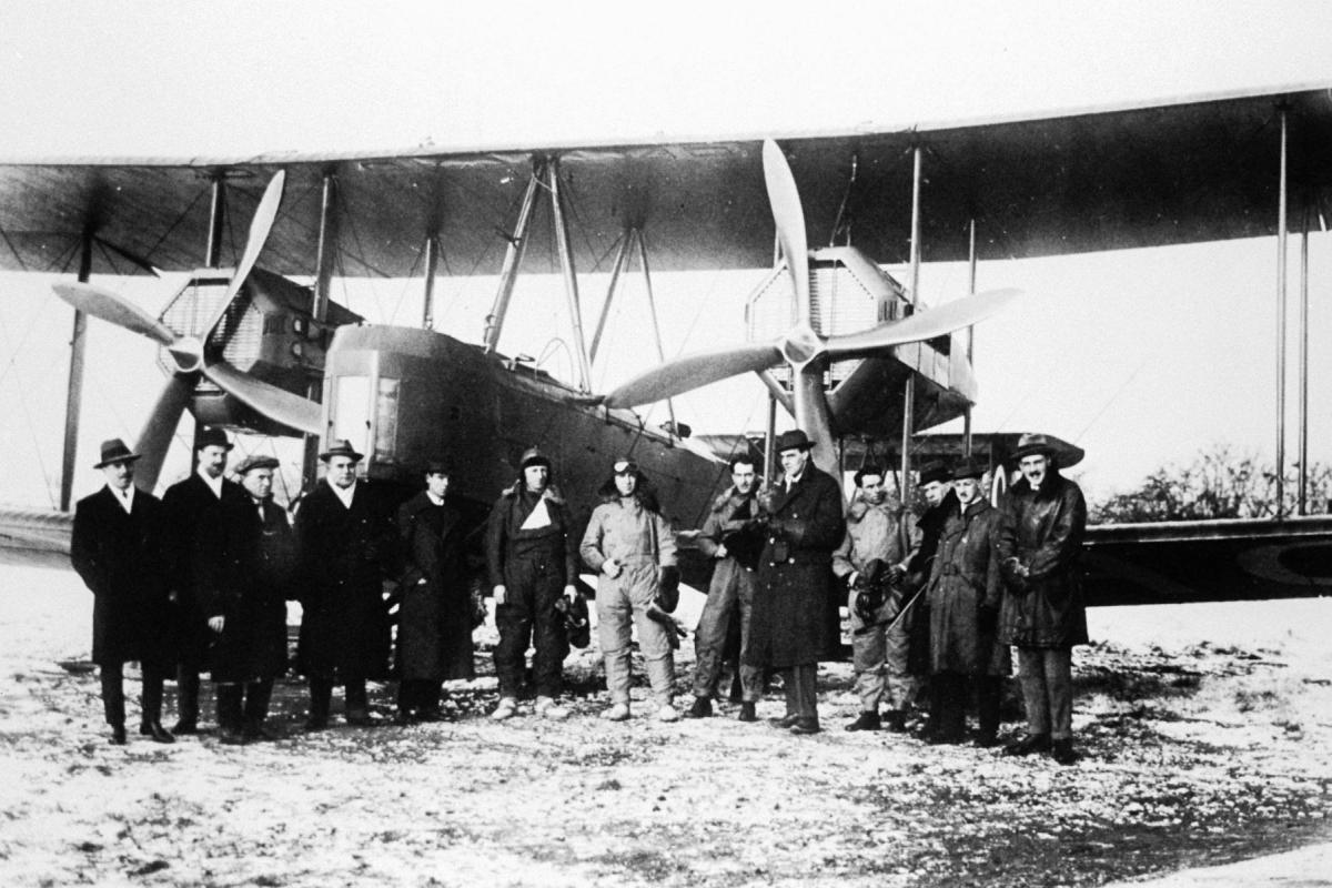 The Smith Brothers, Bennett and Shiers stand beside their Vickers Vimy aircraft before take-off at Hounslow Heath in 1919.