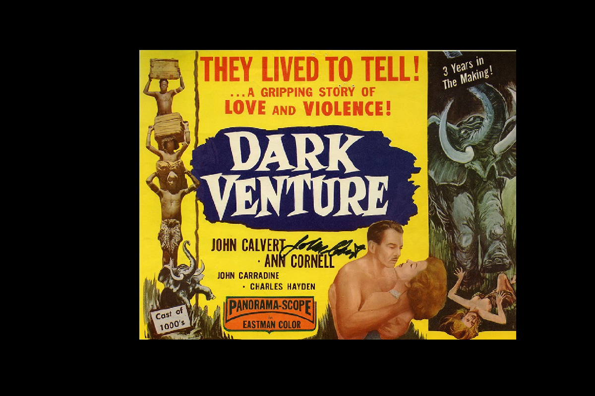 Movie poster for ‘Dark Venture’ depicting African porters, a man and a woman embracing, and a rampaging bull elephant.