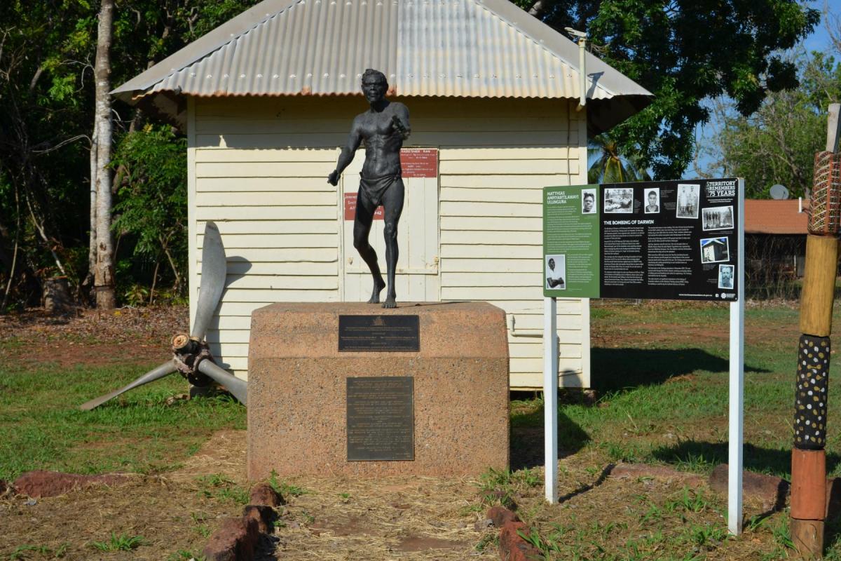 Matthias Ullungura statue on stone plinth at World War Two radio shed.