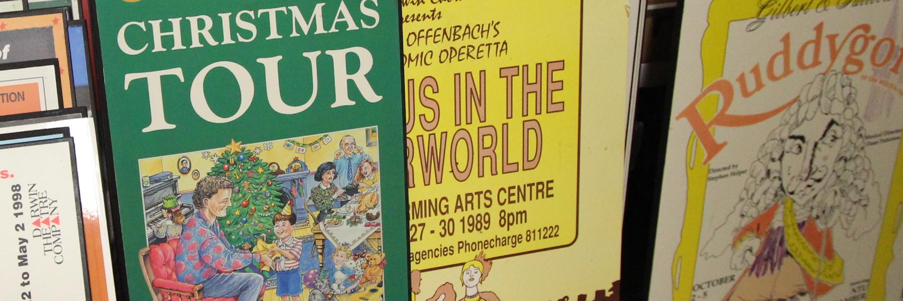 Old Darwin Entertainment Centre posters stacked against one another 