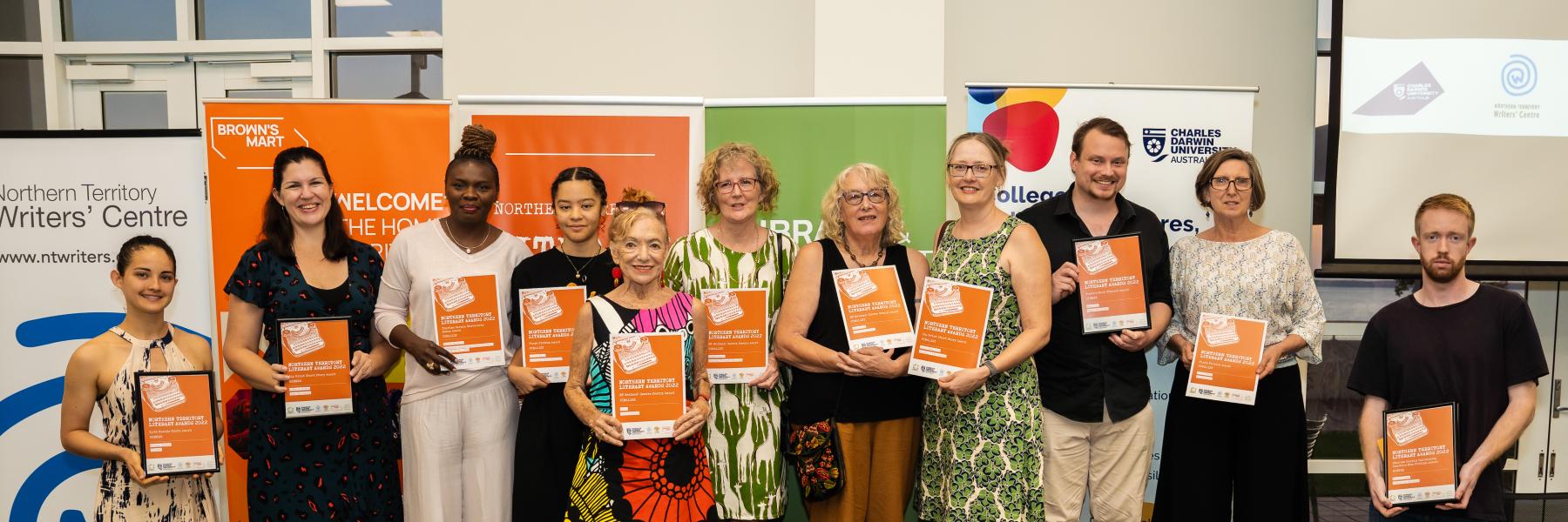 picture of people with certificates and banners in Darwin