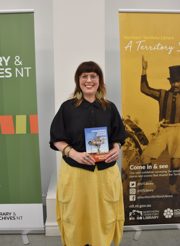 Winner of the Chief Minister's NT History Book Award, Shannyn Palmer, holding her winning publication 'Unmaking Angas Downs'.