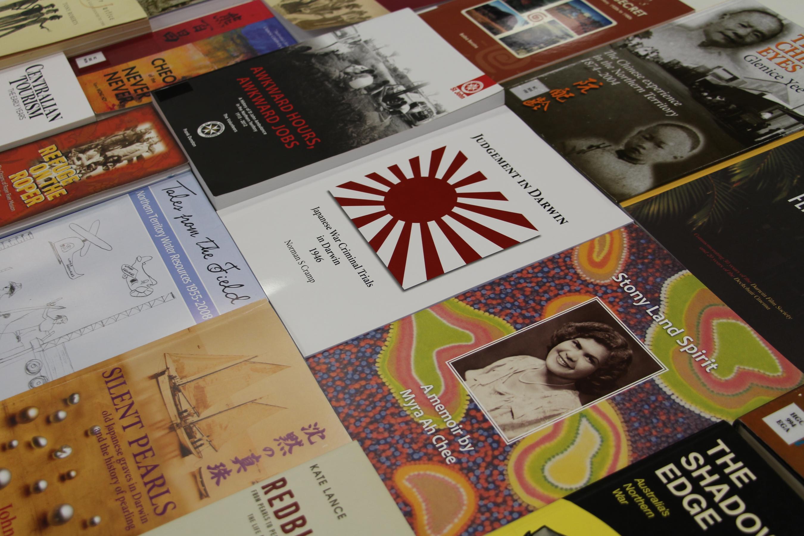 Three rows of history books laid out in a collage. Different book topics represented