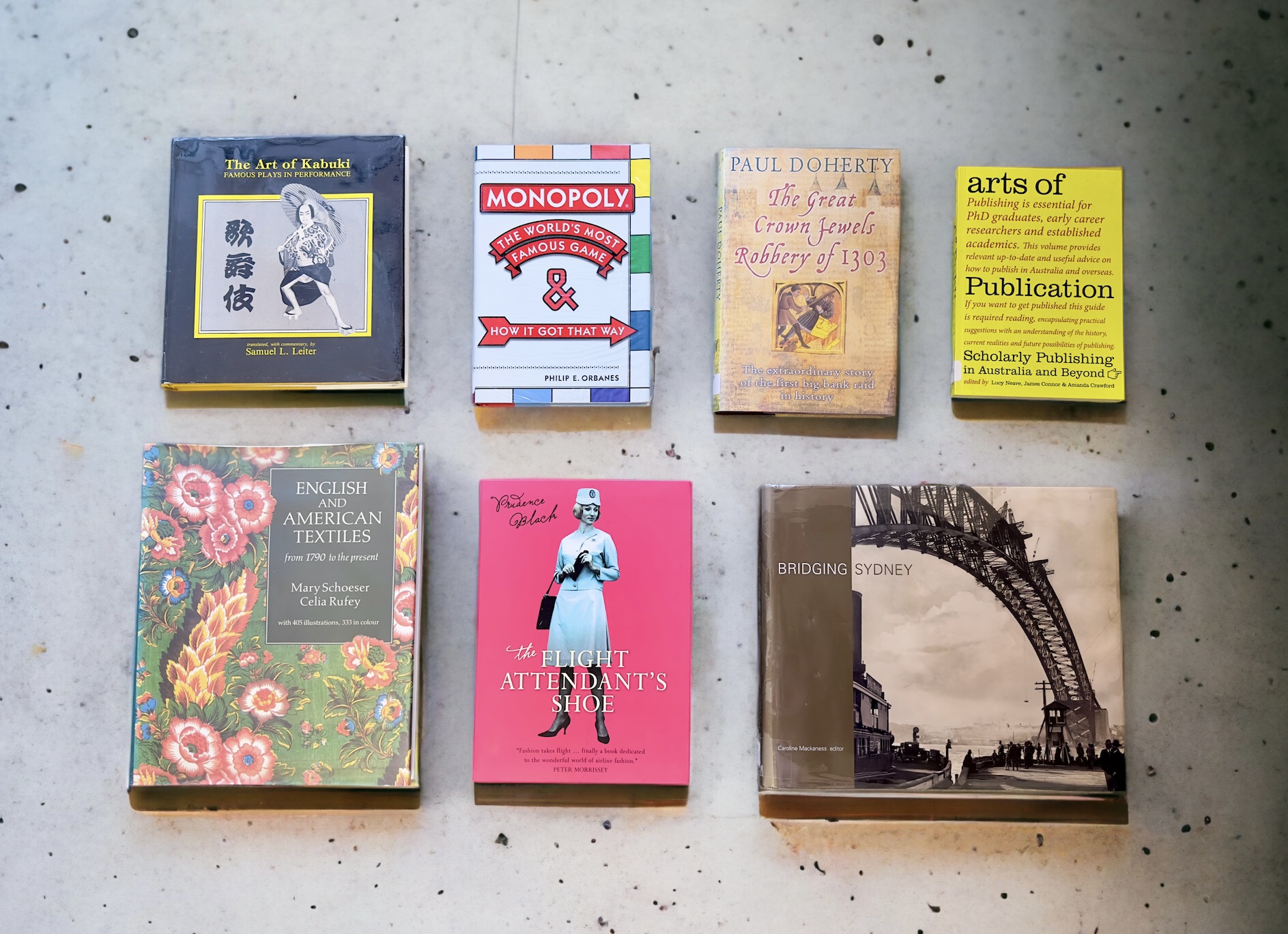 Selection of books on a concrete surface.