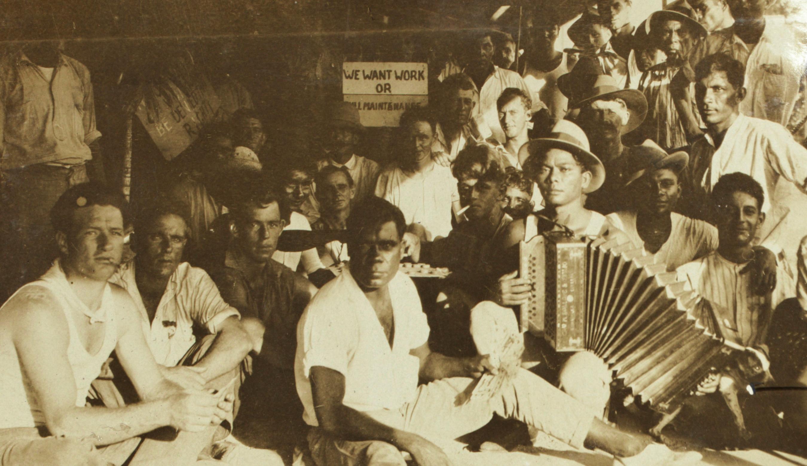 Sepia tone photo of a group of men.