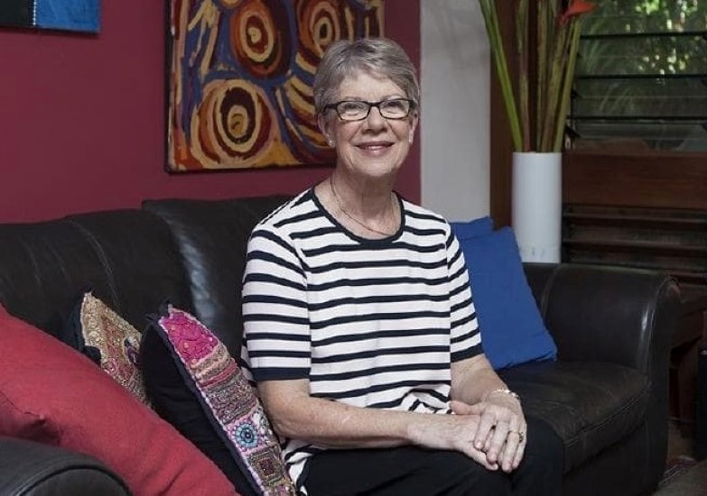 Woman with glasses (Former Chief Minister Clare Martin) sitting on a couch in Territory styled home