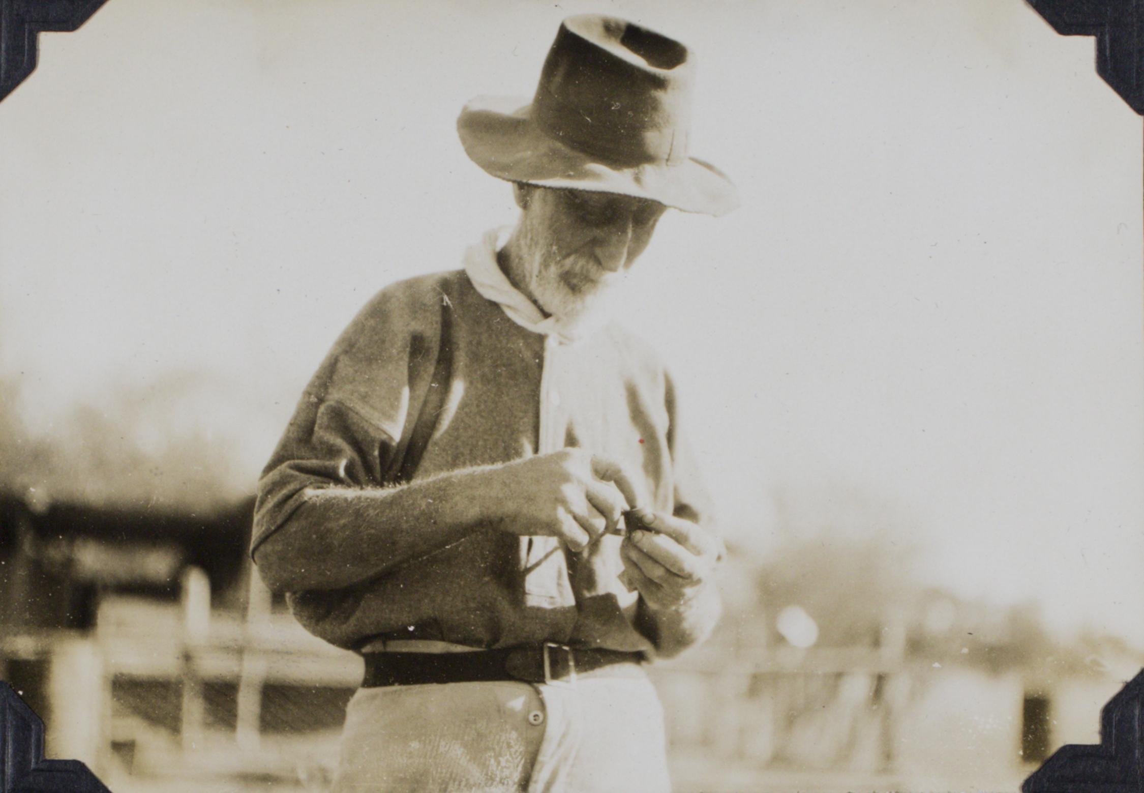 Man standing, looking down