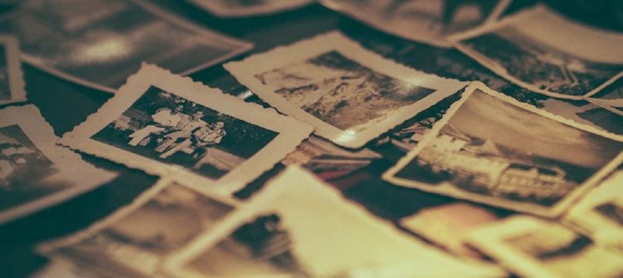 Image of photos scattered on a table top