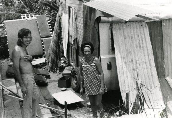 Bill and Polly Day at their van, covered in aluminium sheeting, on corner of McMinn Street