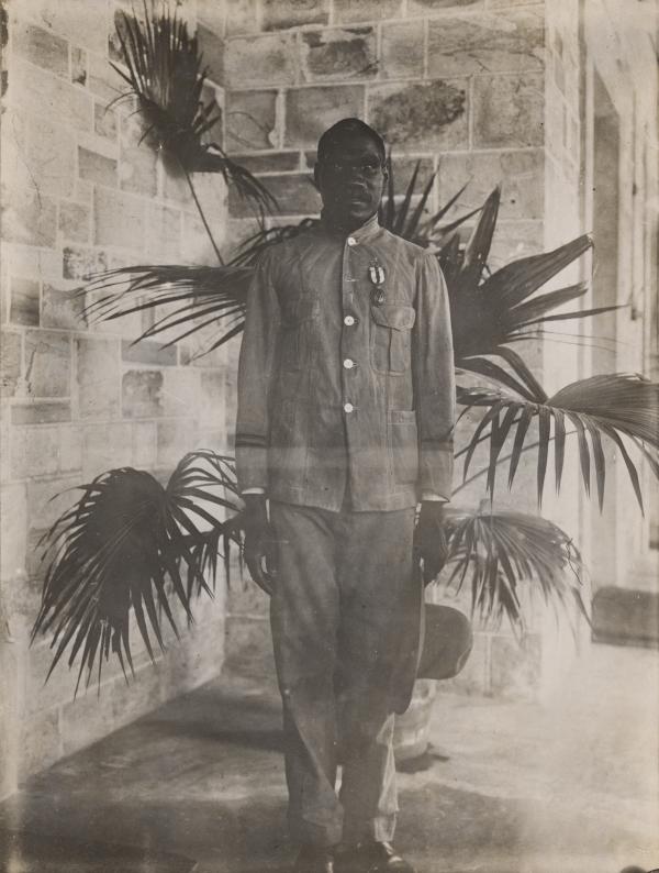 Ayaiga standing an posing for a photograph after having received the Albert Medal. Medal is pinned on left hand chest. 