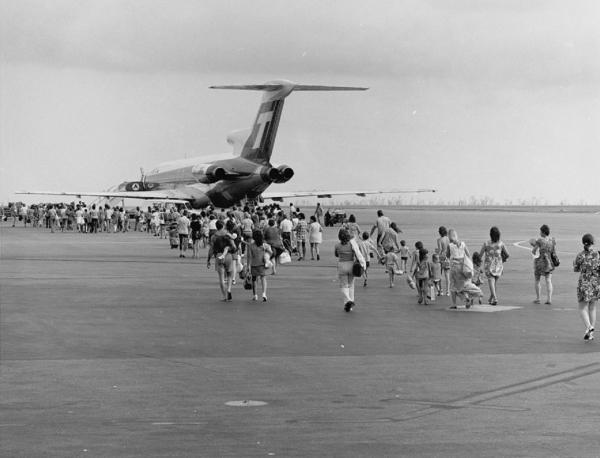 A line of evacuees boarding a TAA plane at Darwin airport