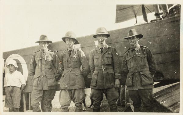 James Bennett, Ross Smith, Keith Smith and Wally Shiers standing in front of their Vickers Vimy in 1919.