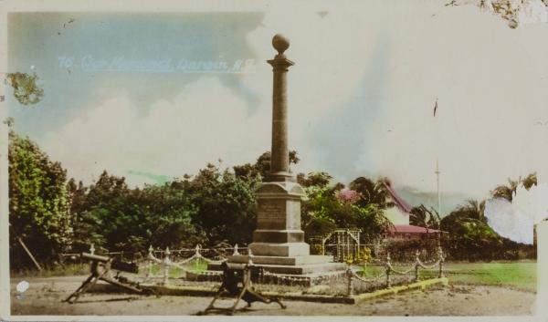 The Cenotaph is at Centre with Government House in the background and two machine guns in the foreground.