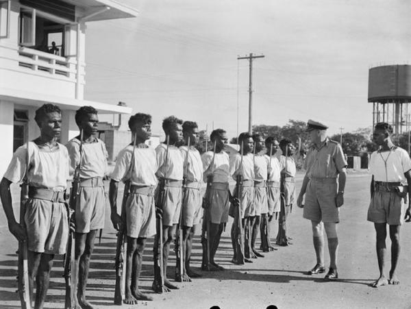 Tiwi Coastwatchers in uniform, standing in a line at HMAS Melville, Darwin.