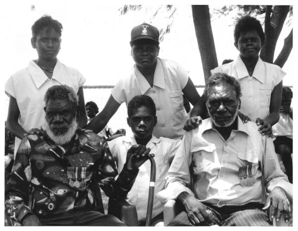 Tiwi veterans seated together with family members.