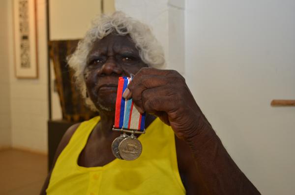 Mary Moreen holding medals.